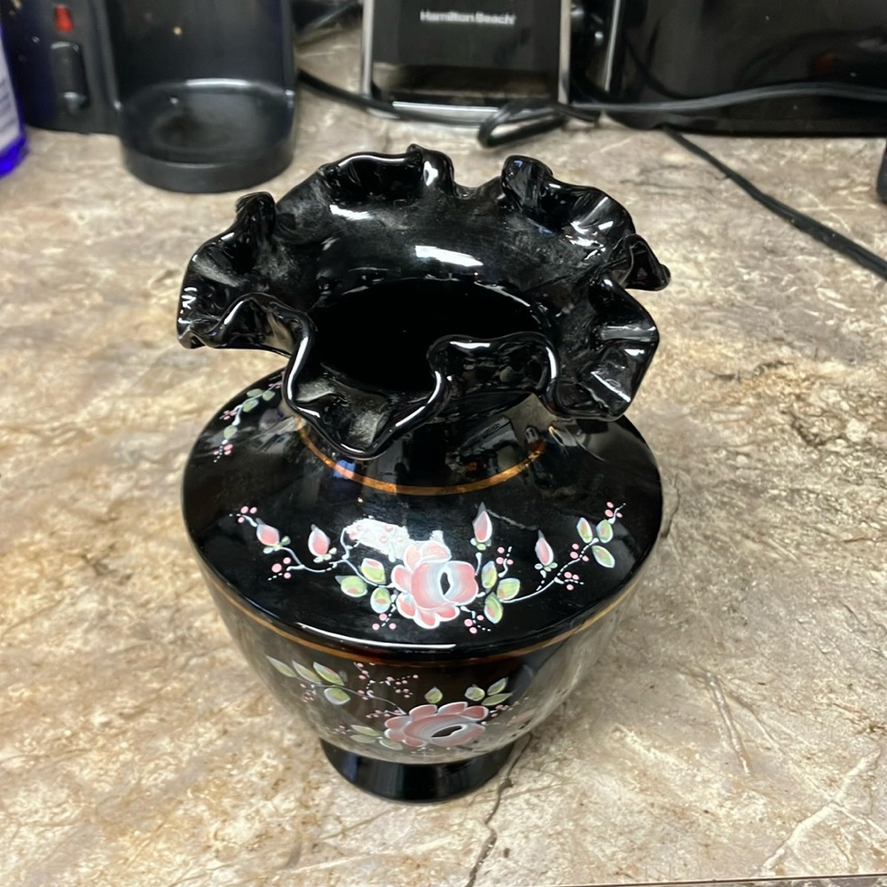 Black Fenton vase. Pink & green floral design.  Signed K Lauderman